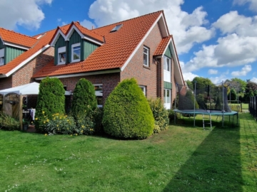 Gepflegtes Reihenendhaus mit Garage und Gartengrundstück in Süd-Westlage, 26835 Hesel, Reihenendhaus